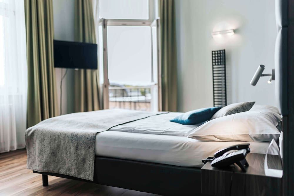 afbeelding van Standaard kamer, 1 kingsize bed, uitzicht op stad