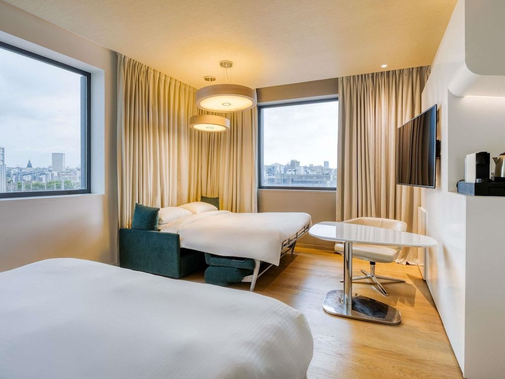 afbeelding van Familiekamer, 1 kingsize bed met slaapbank, uitzicht op stad