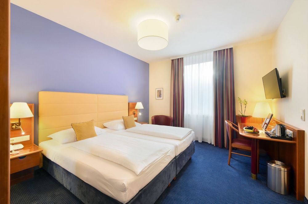 afbeelding van Comfort kamer, 1 twee- of 2 eenpersoonsbedden, uitzicht op binnenplaats