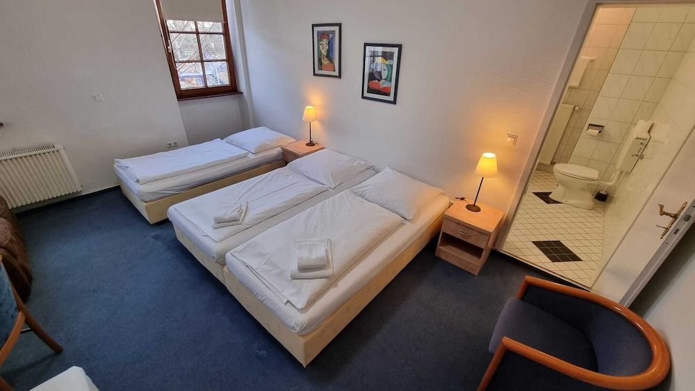 afbeelding van Comfort vierpersoonskamer, privébadkamer, uitzicht op stad